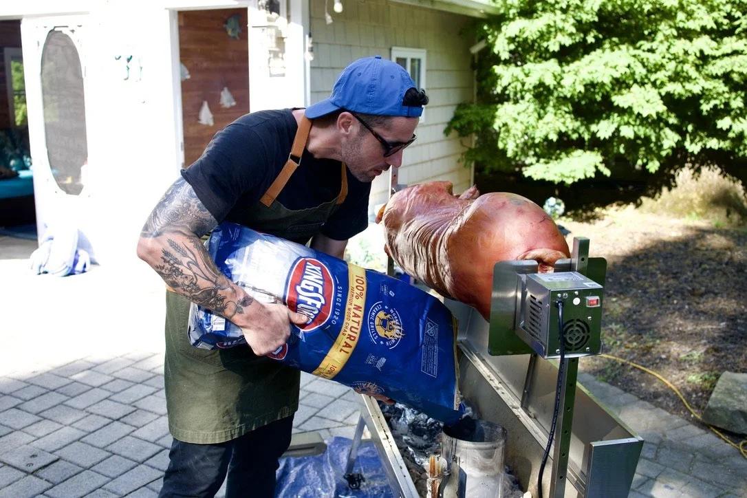 Charcoal pit pig roast at a private party