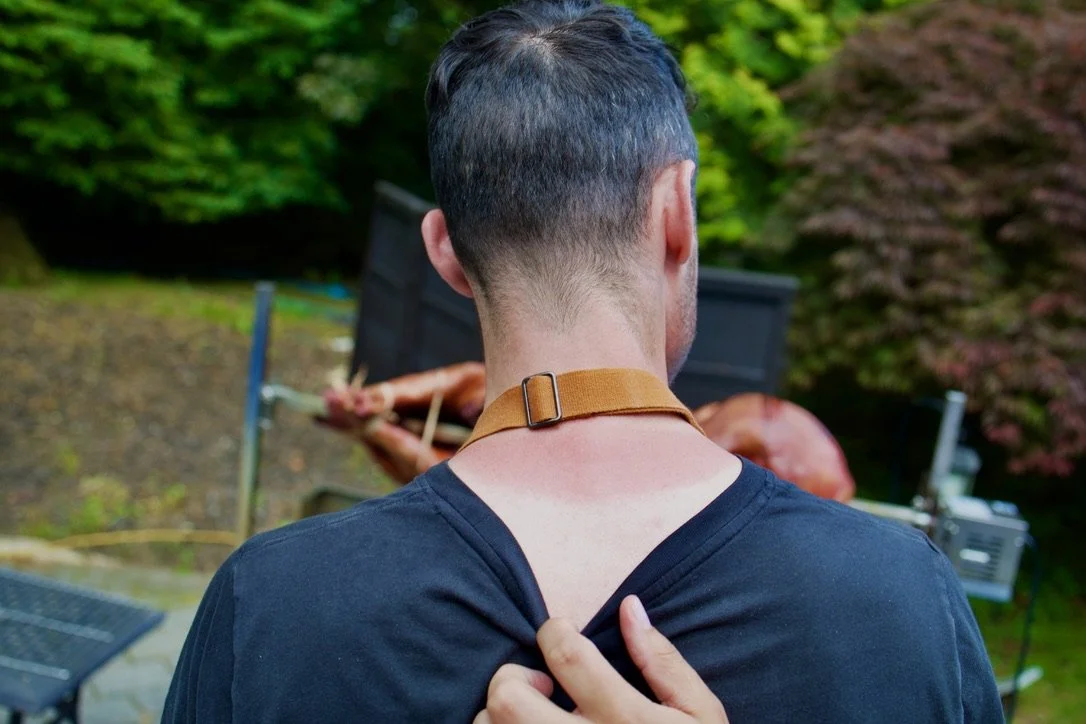 Chef Christopher LaMagna at the pig roast — sunburn visible at the collar line