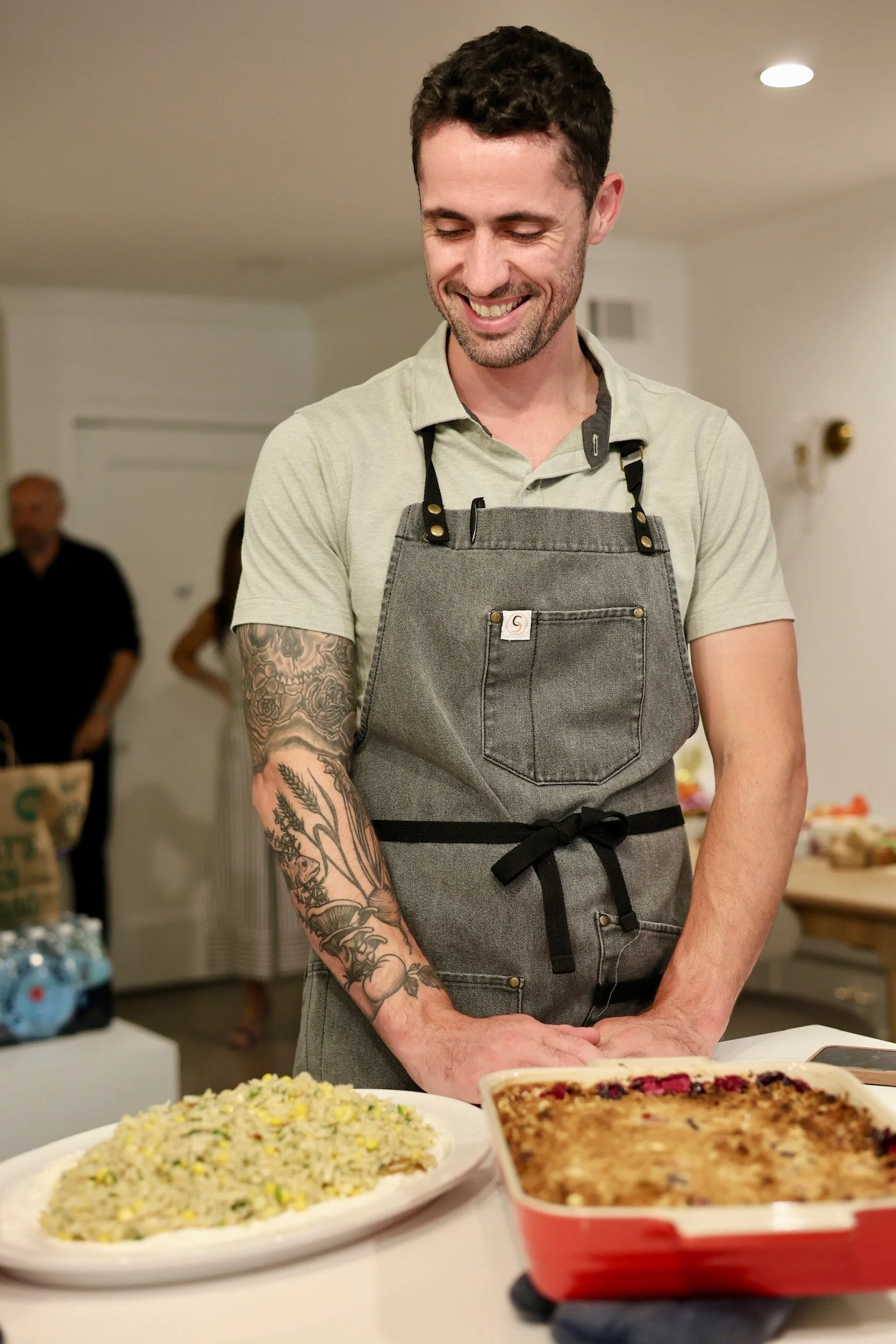 Guest learning to shape pasta with Chef Christopher LaMagna