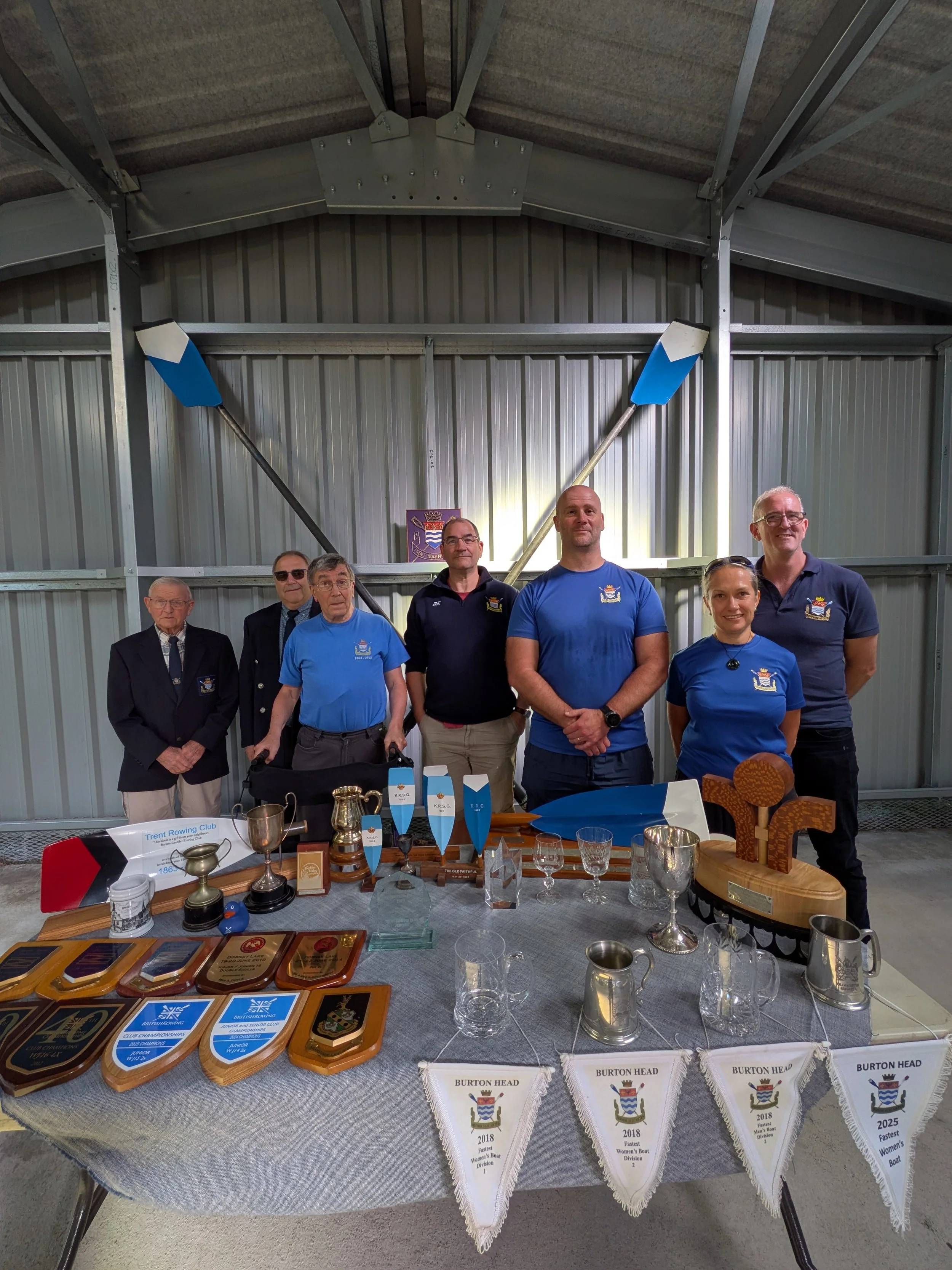 Trent Rowing Club members and trophies inside the Boat Barn