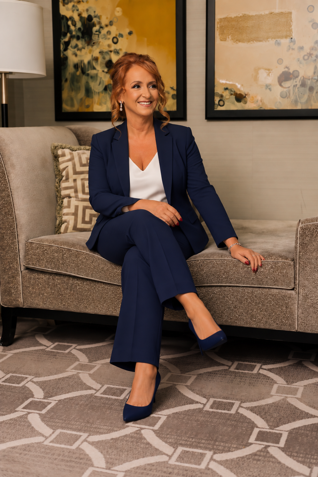Jimena Szychowski seated in a navy suit