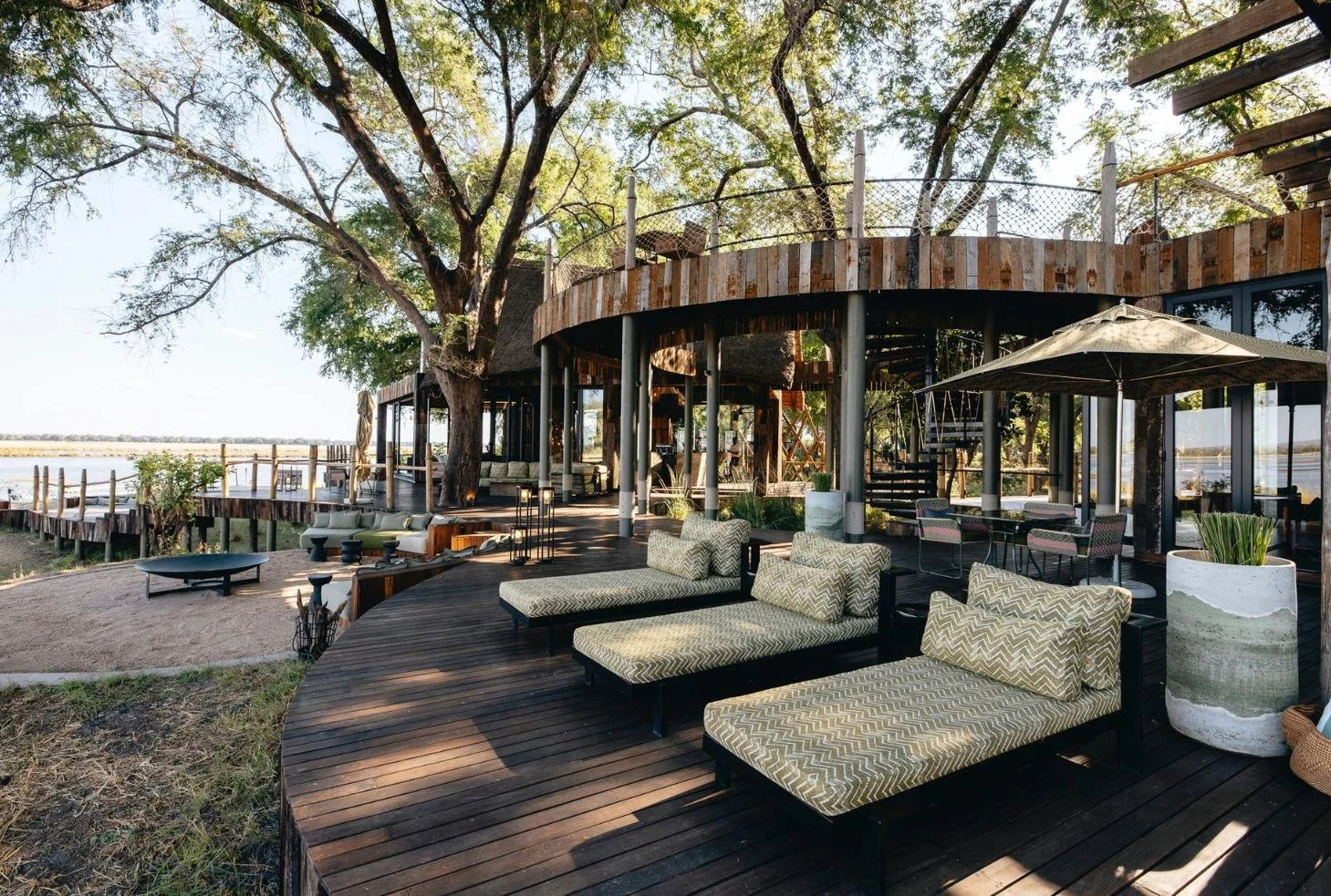 Lolebezi riverfront deck with daybeds overlooking the Zambezi River, Lower Zambezi National Park, Zambia