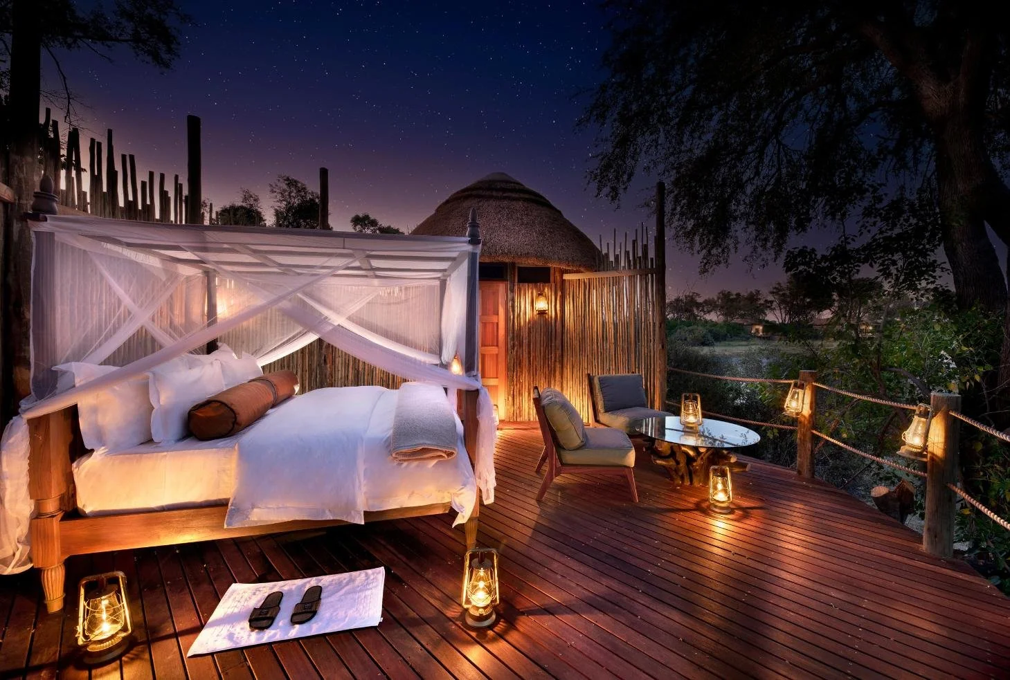 Star bed deck at Atzaro Okavango Camp under a sky of stars, Okavango Delta Botswana