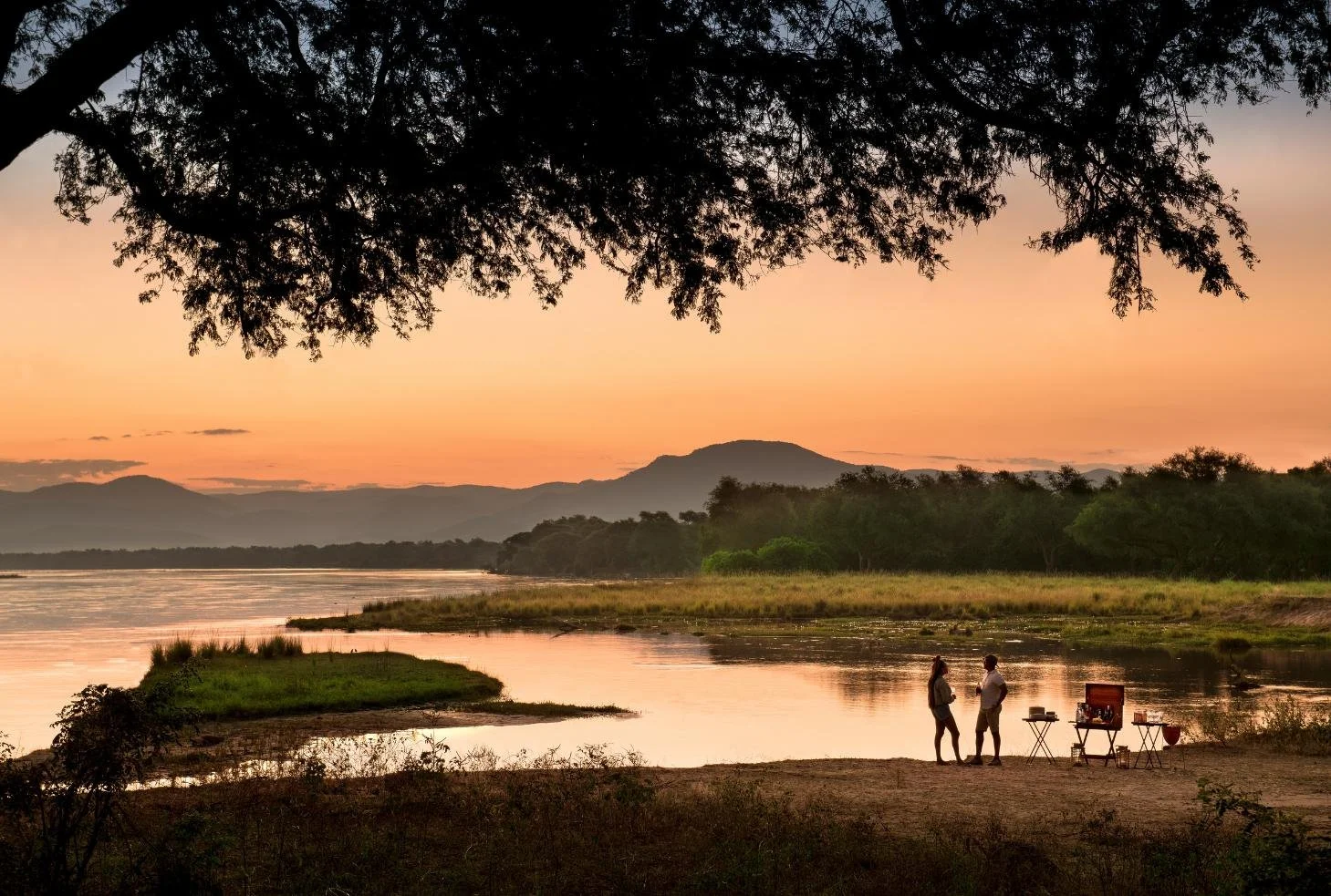 Lower Zambezi sunset on the river bank with private sundowners from Lolebezi Lodge, Zambia, Nomara