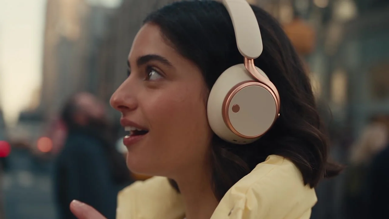 A woman wearing headphones in a Blackstars product commercial