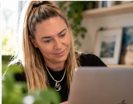 Kirsty Skeates reviewing a client's website content on her laptop