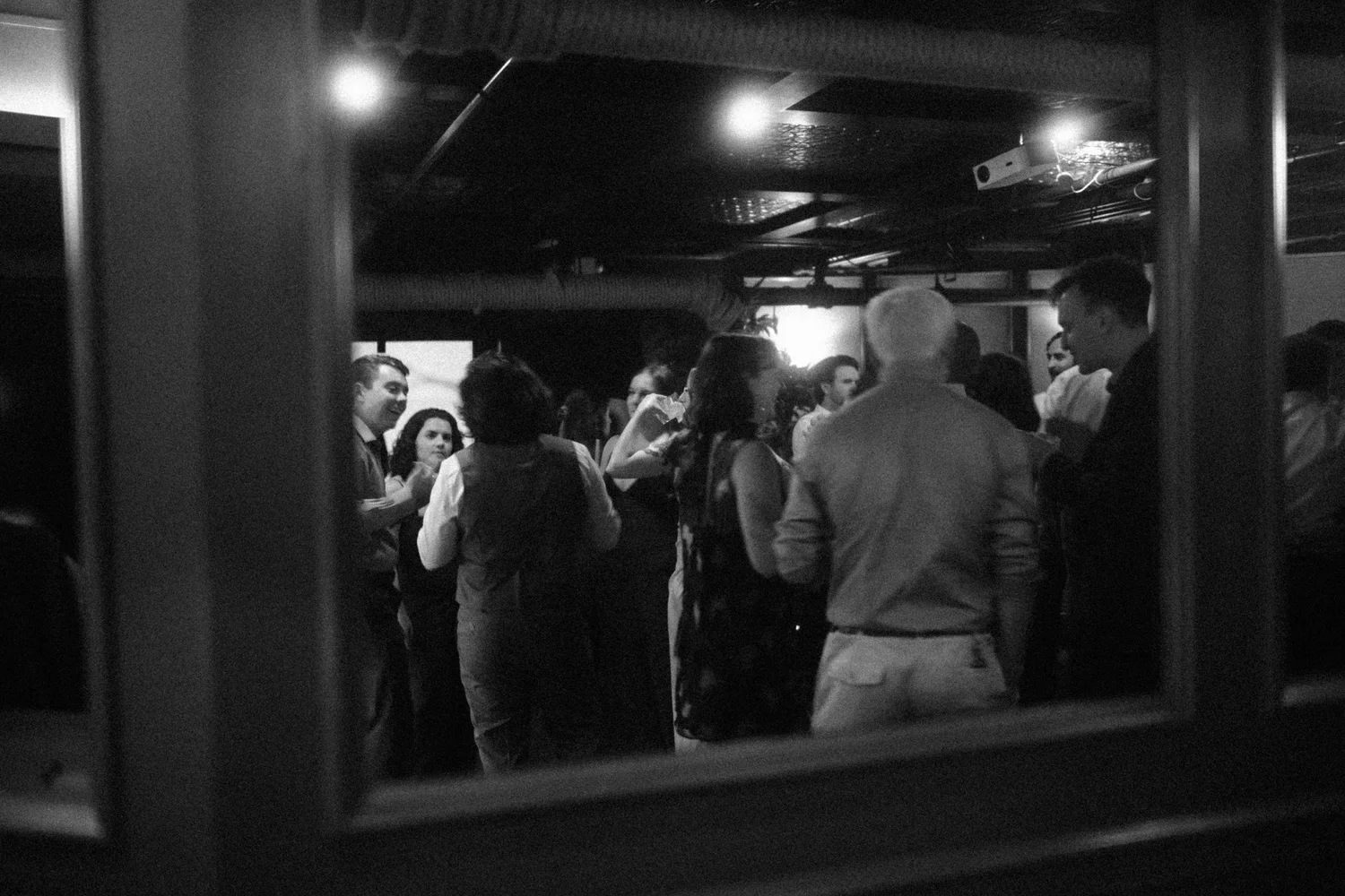Dance floor seen through a window at the after-party