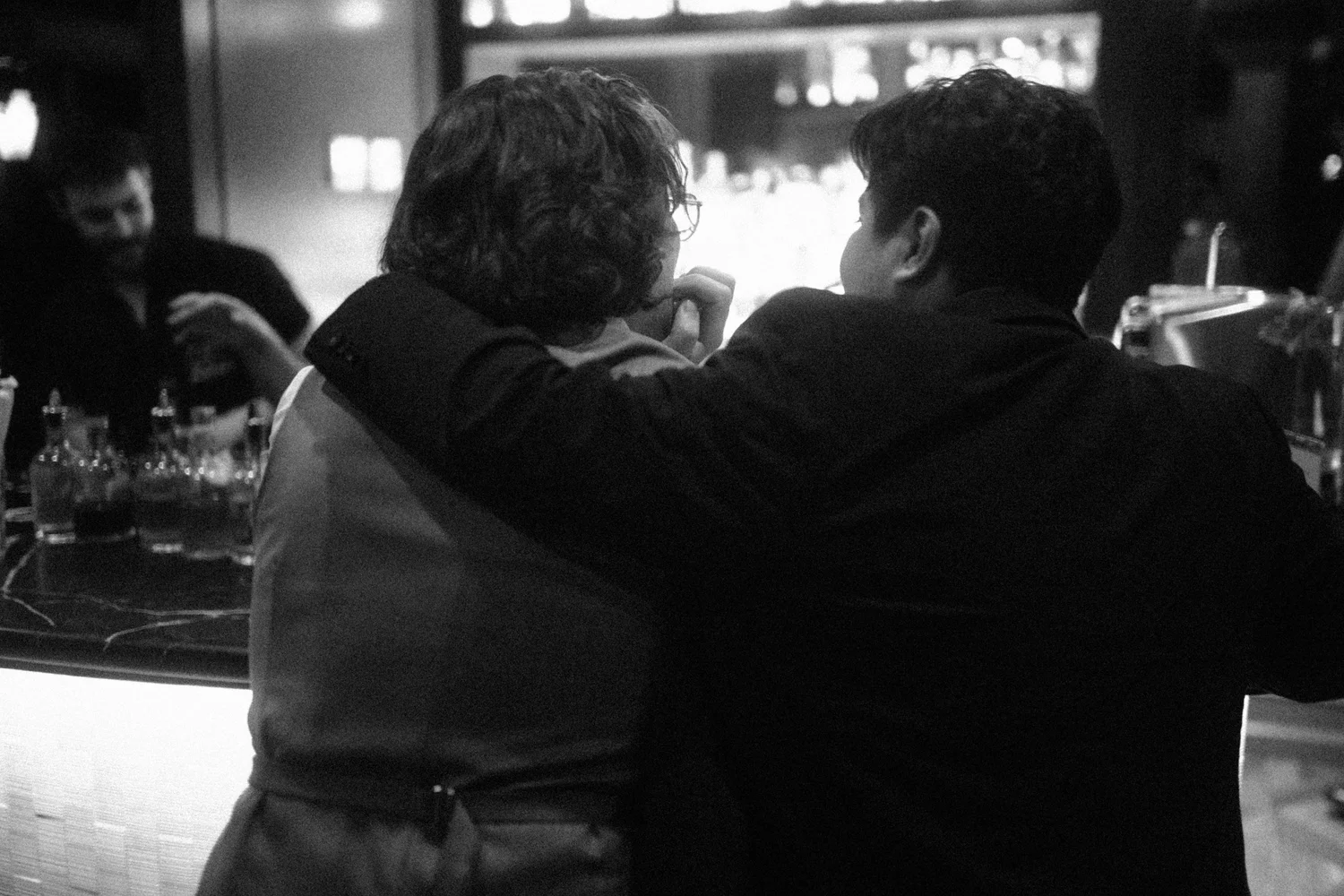 Couple arm in arm at the bar