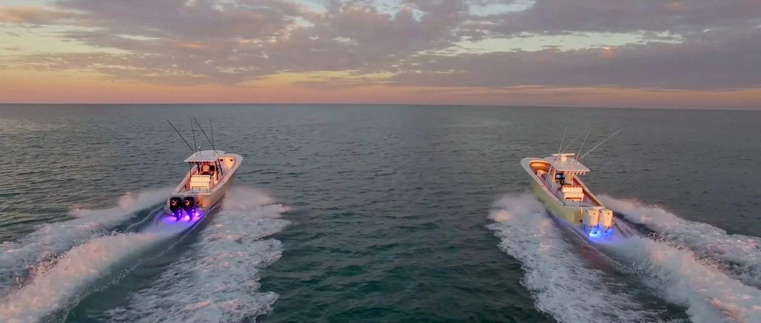 Two Mag Bay Yachts 33 boats at sunset off Miami