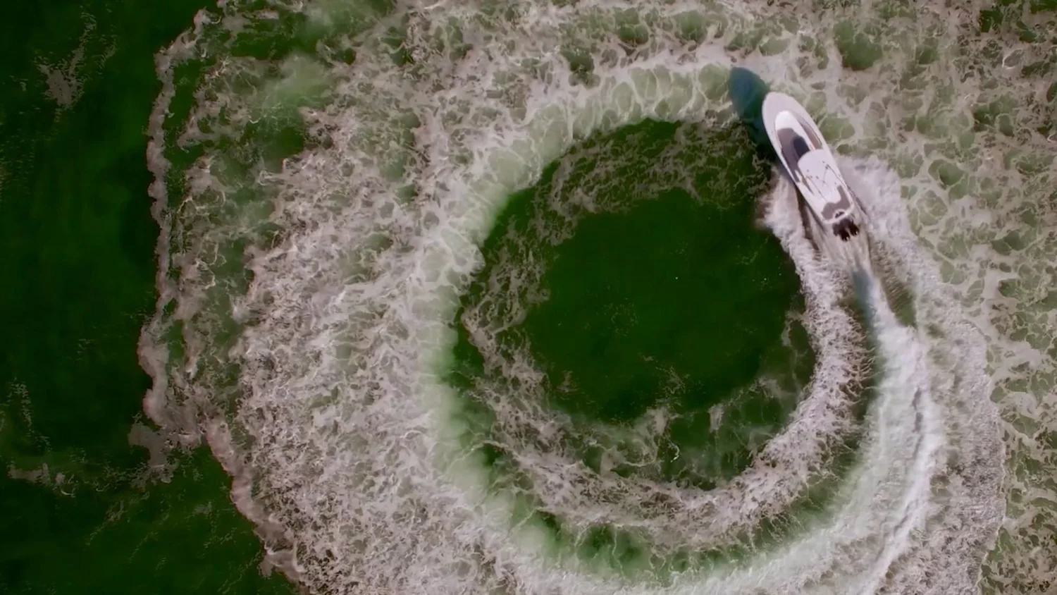 Top-down aerial of a Mag Bay Yachts 33 on blue water