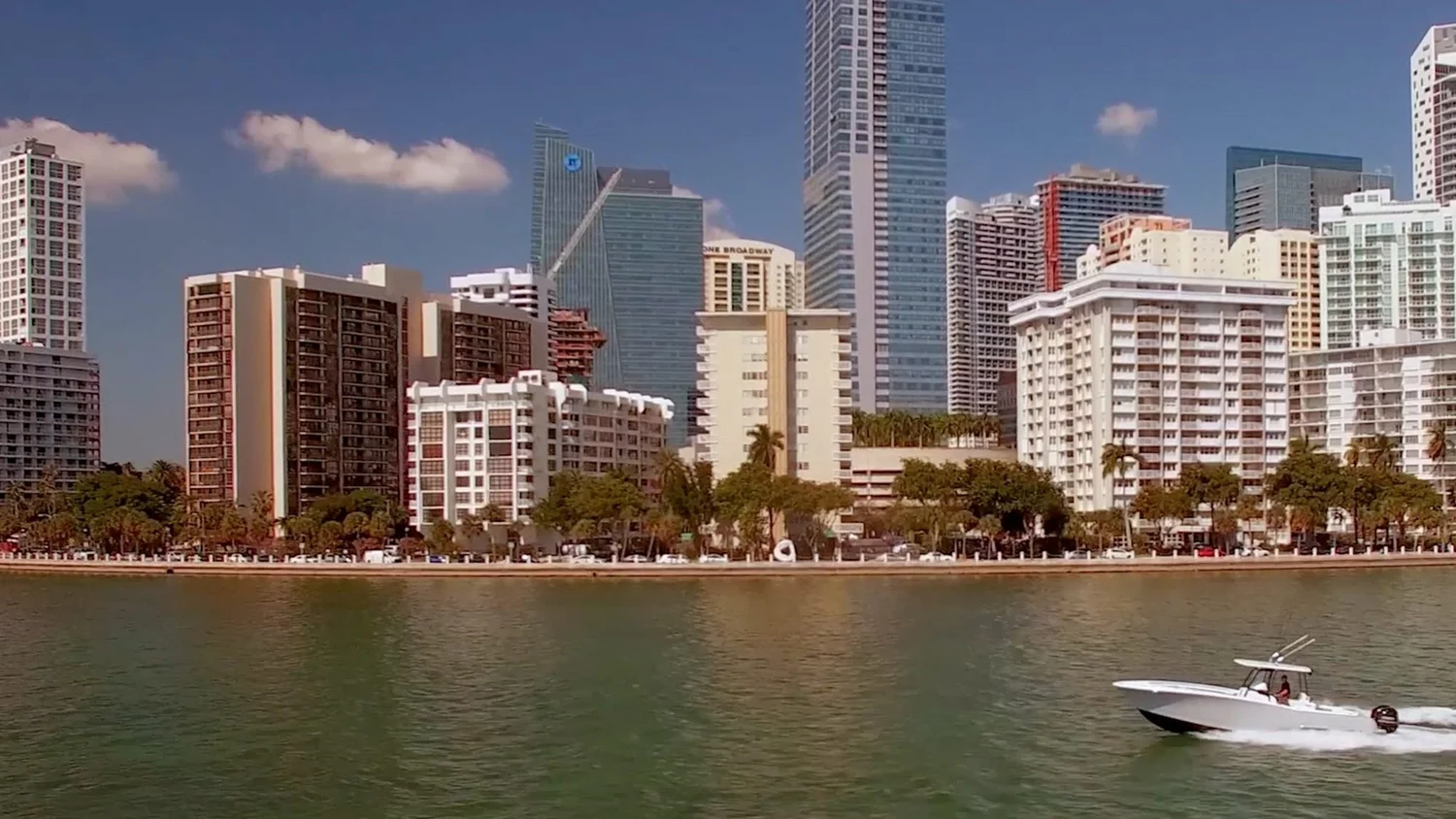 Mag Bay Yachts 33 running past the Miami skyline