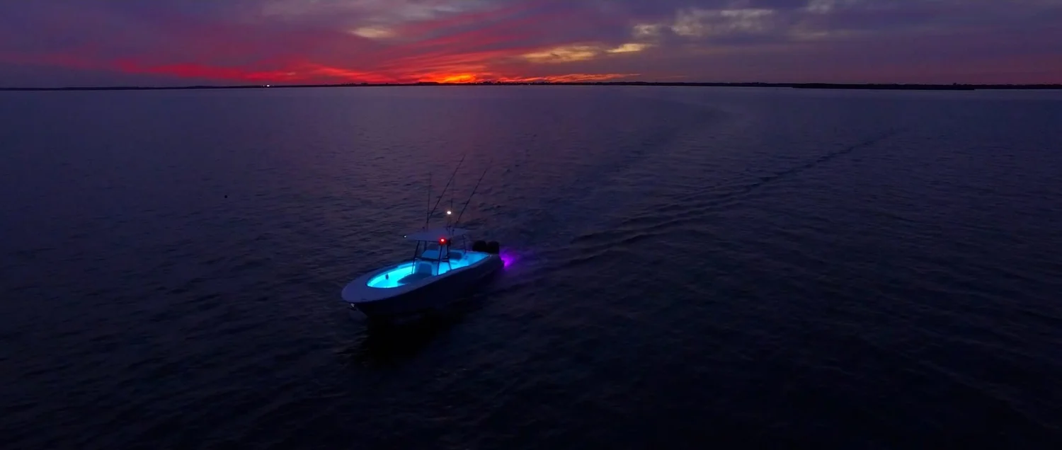 Mag Bay Yachts 33 underwater LED lighting at night, aerial view