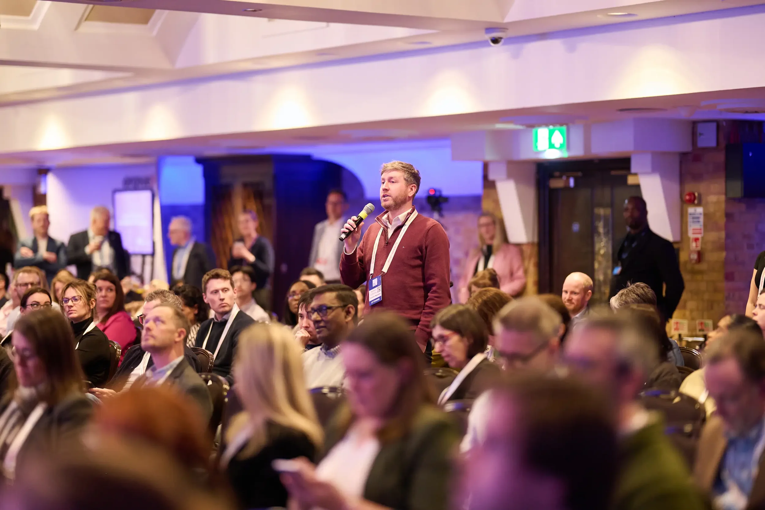 Delegate contributing a question during an SWP Summit session