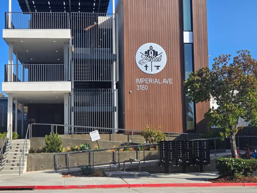 Entry ramp and stairs with landscaped planters at 3180 Imperial Ave, San Diego