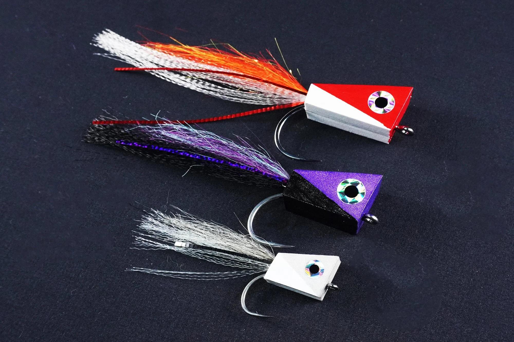 MF Mega NYAP Popper — topwater predator fly on black background
