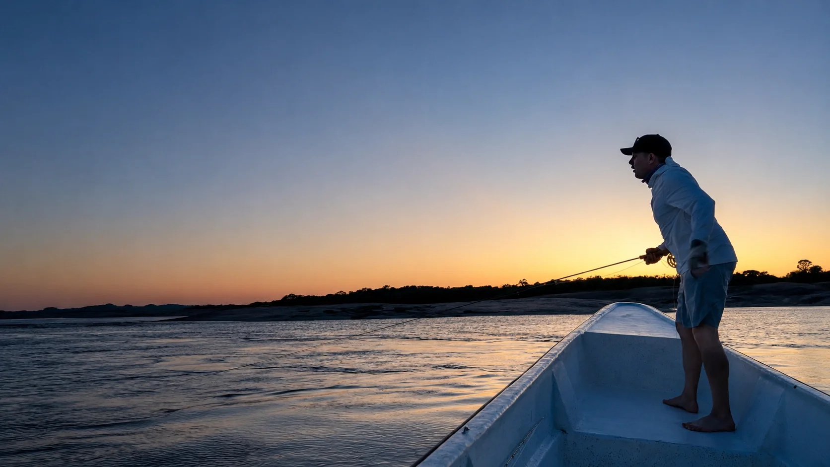 Professional fly fishing guide on the water during a Megafin field session