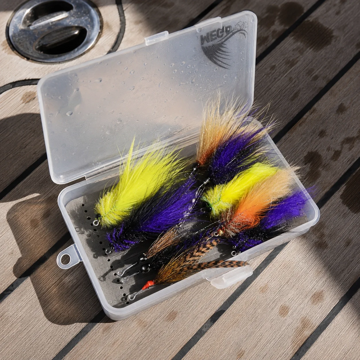 Tarpon fly box with toad deceiver and cockroach patterns for saltwater fly fishing