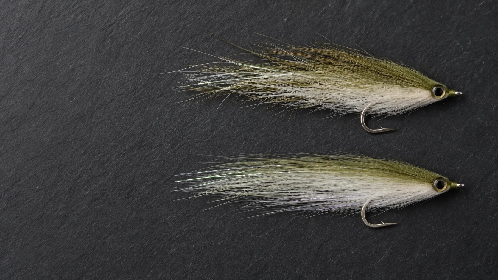 Two predator flies with the same silhouette built from different materials