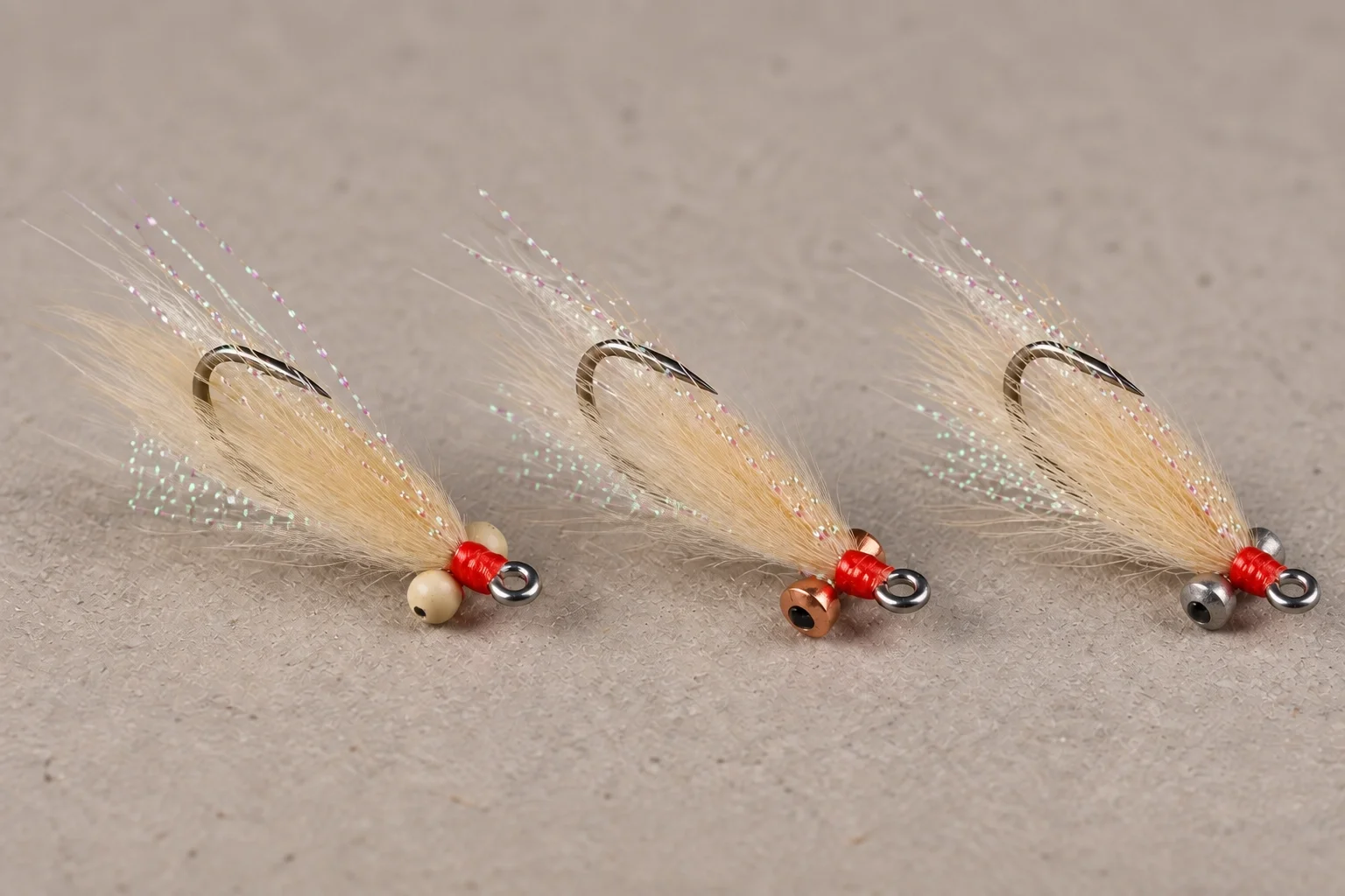 Dumbbell, bead-chain, and tungsten eyes used to weight flies