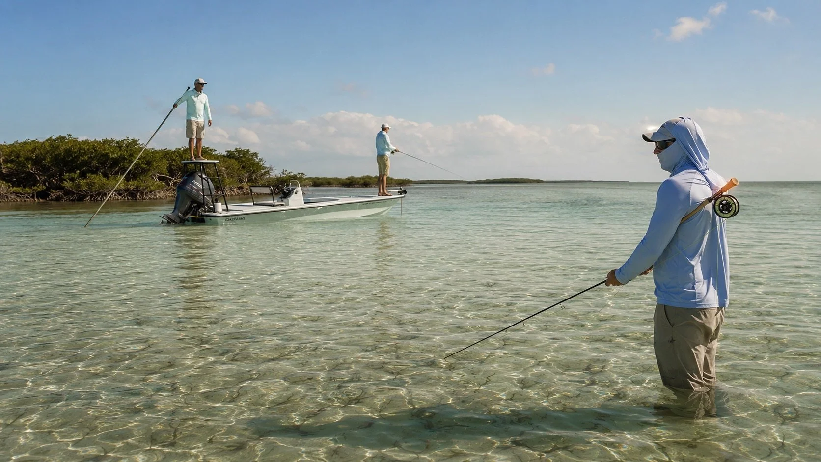 Fly anglers sight fishing from a skiff on clear Florida Keys flats