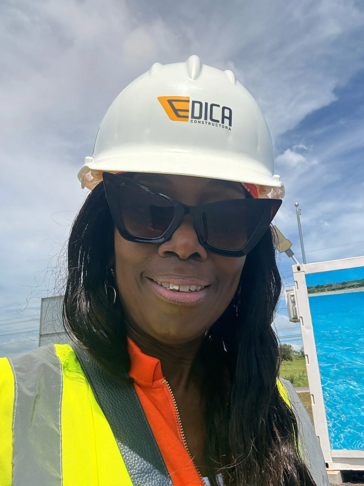 Nana Noi in a hard hat on a construction site in Portugal