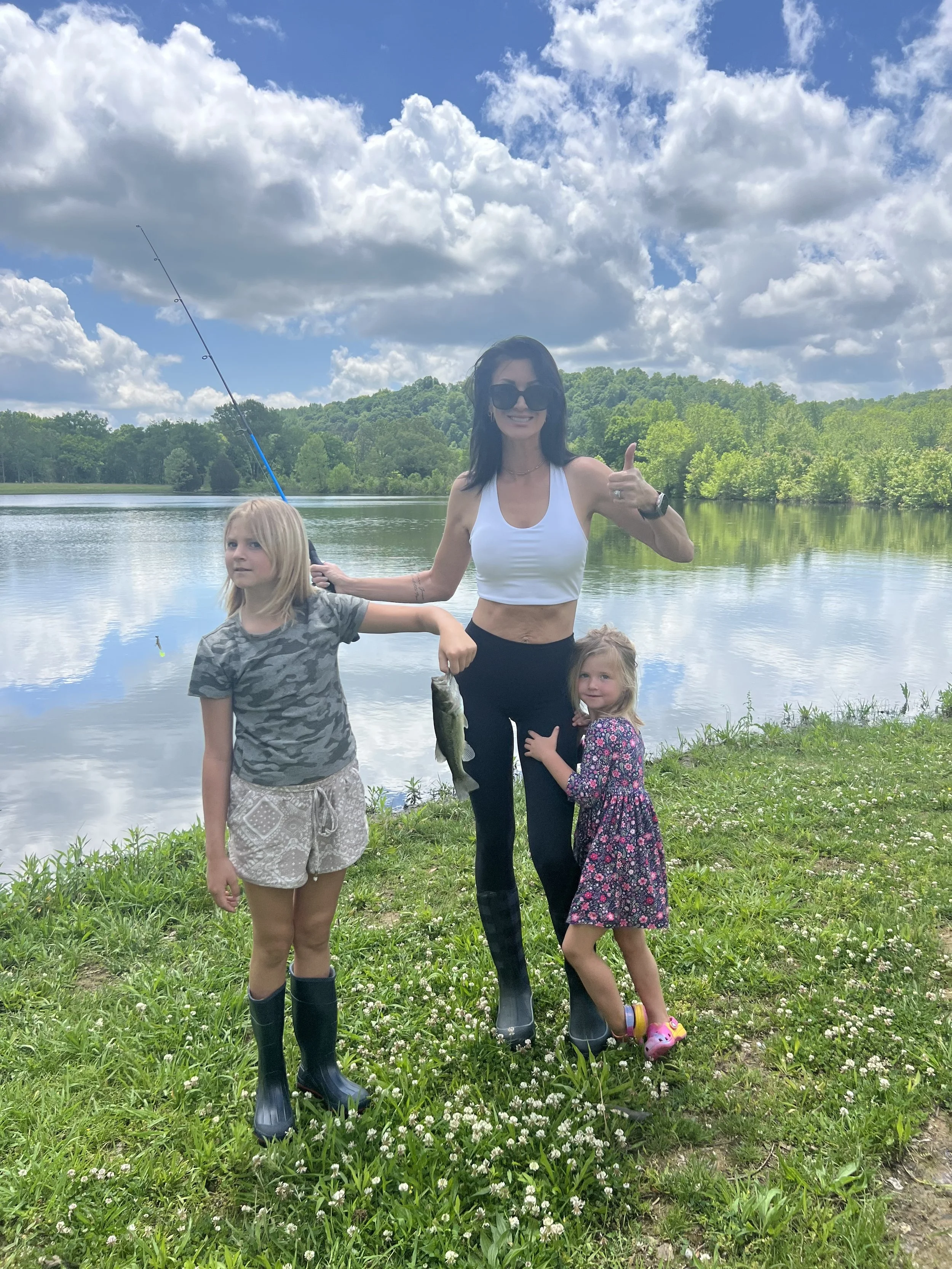 Courtney, Claire, and Charlotte fishing by the lake
