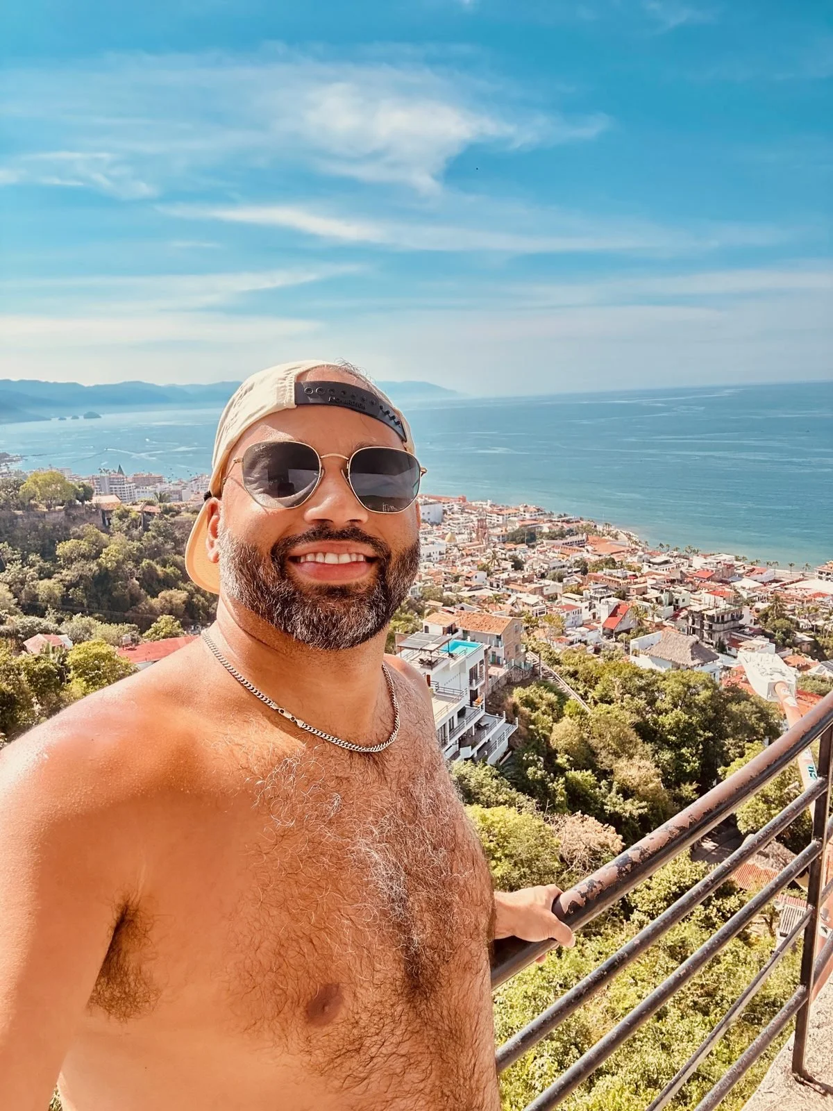 Black gay man in Puerto Vallarta overlooking the Bay of Banderas