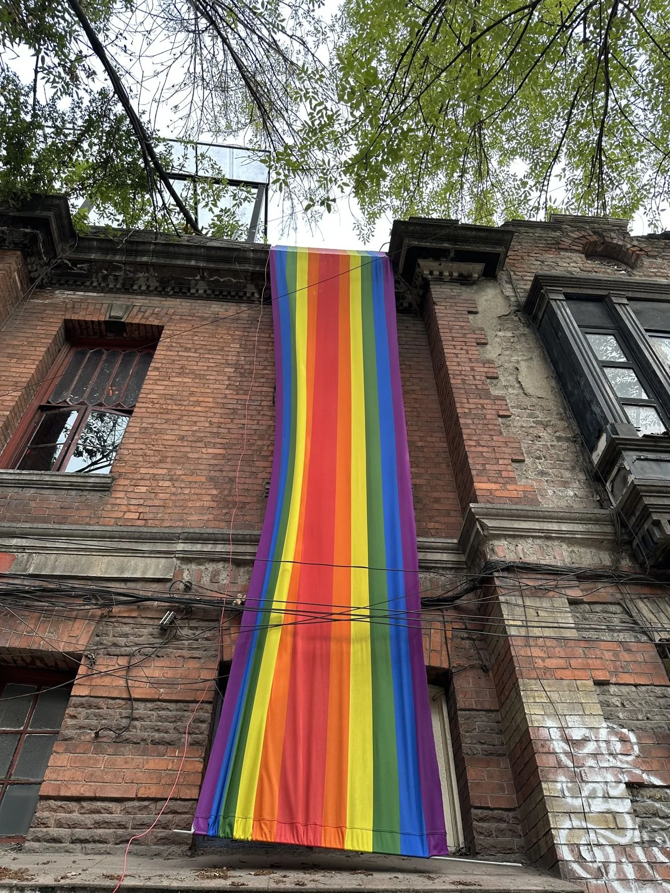 Mexico City travel – rainbow flag on a brick building