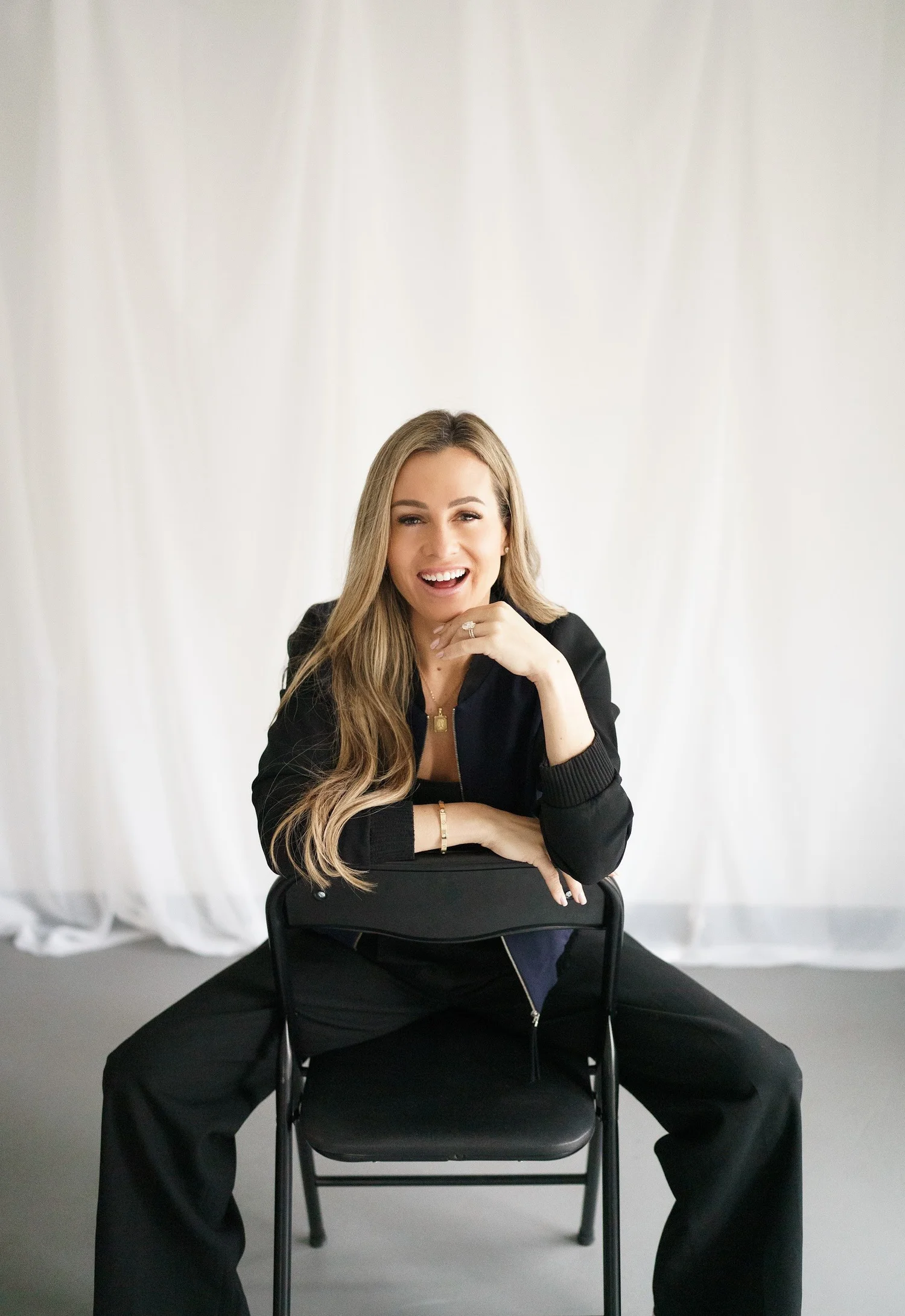 Court Coulter, seated, in a studio portrait