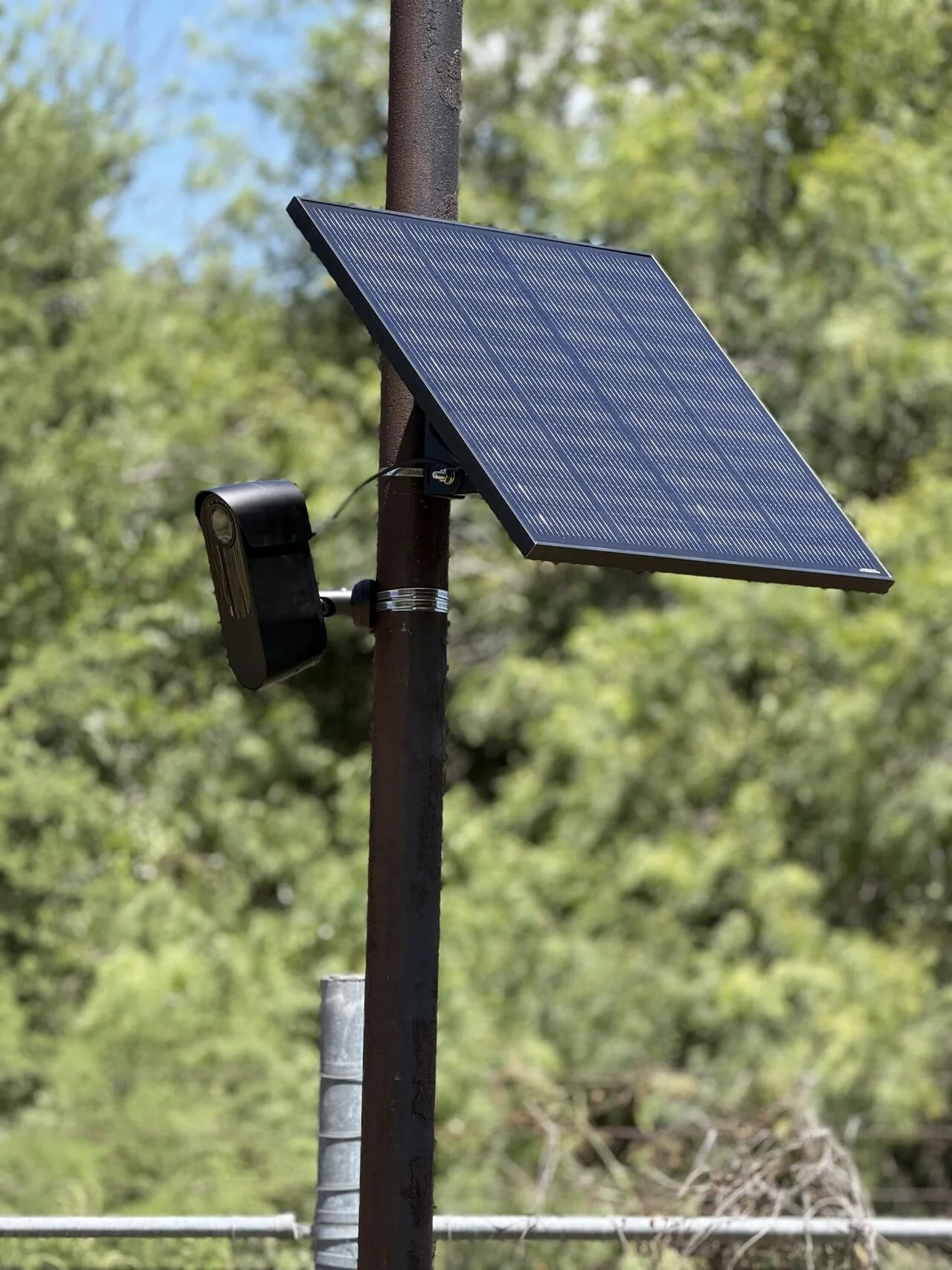 Verkada remote surveillance camera and solar panel mounted on a pole