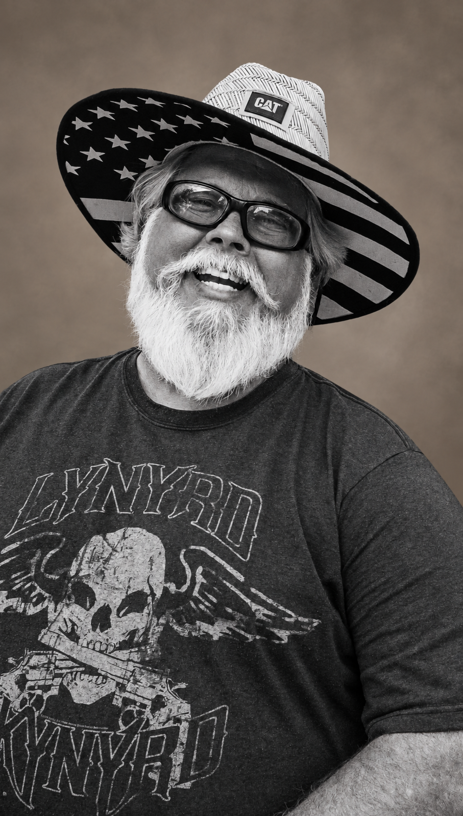 Our founder’s father smiling in his hat, the portrait behind the Simple Man logo