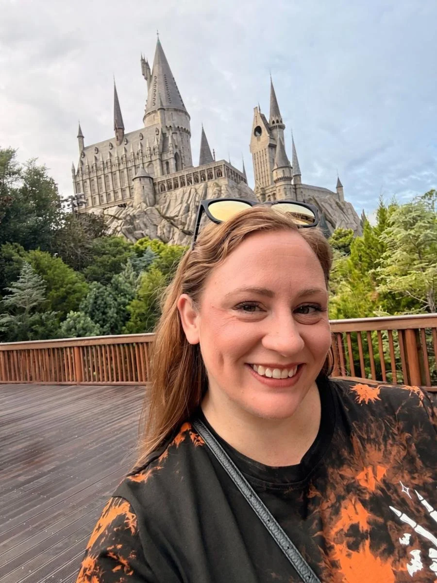 Mikayla Craft in front of Hogwarts castle at Universal Orlando Resort