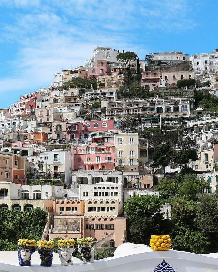 Colorful hillside homes stacked above the sea in Positano, Italy