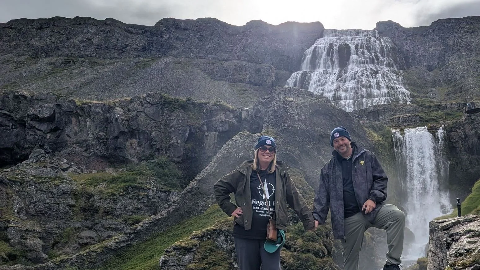 Jay and Becca Dill, owners of The Travel Junkie, at Dynjandi waterfall in Arnarfjörður, Westfjords, Iceland