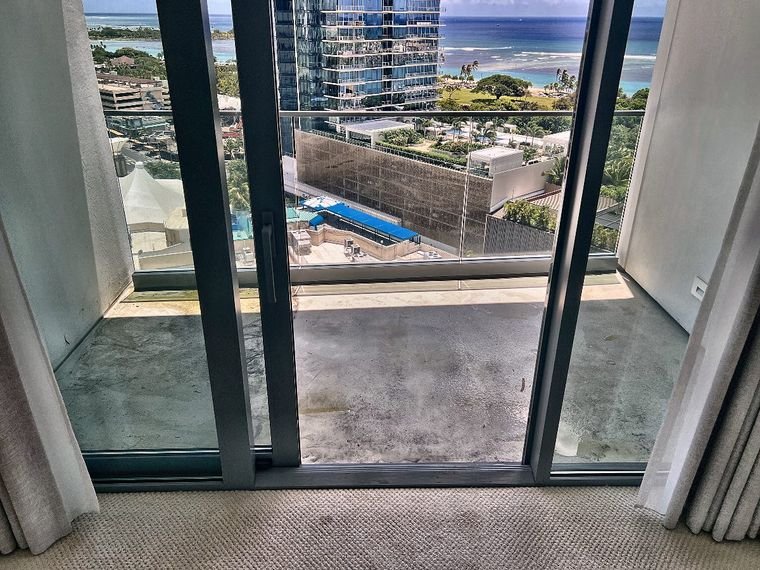 Clean high-rise lanai with ocean views after move