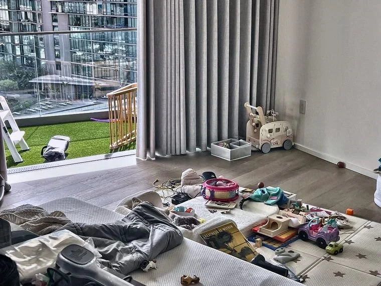 Living space cluttered with toys and items before move