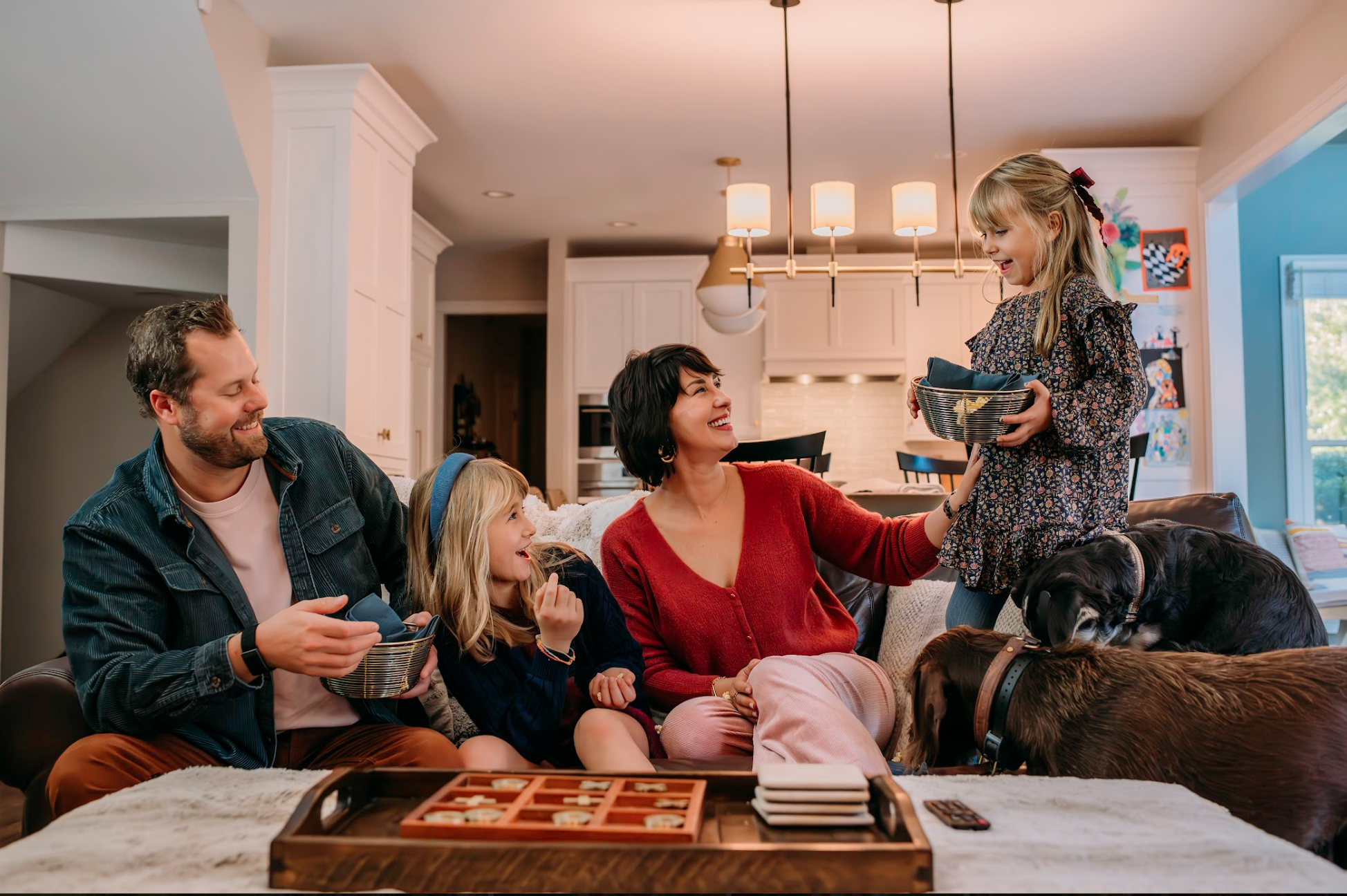 Styled client family laughing together indoors