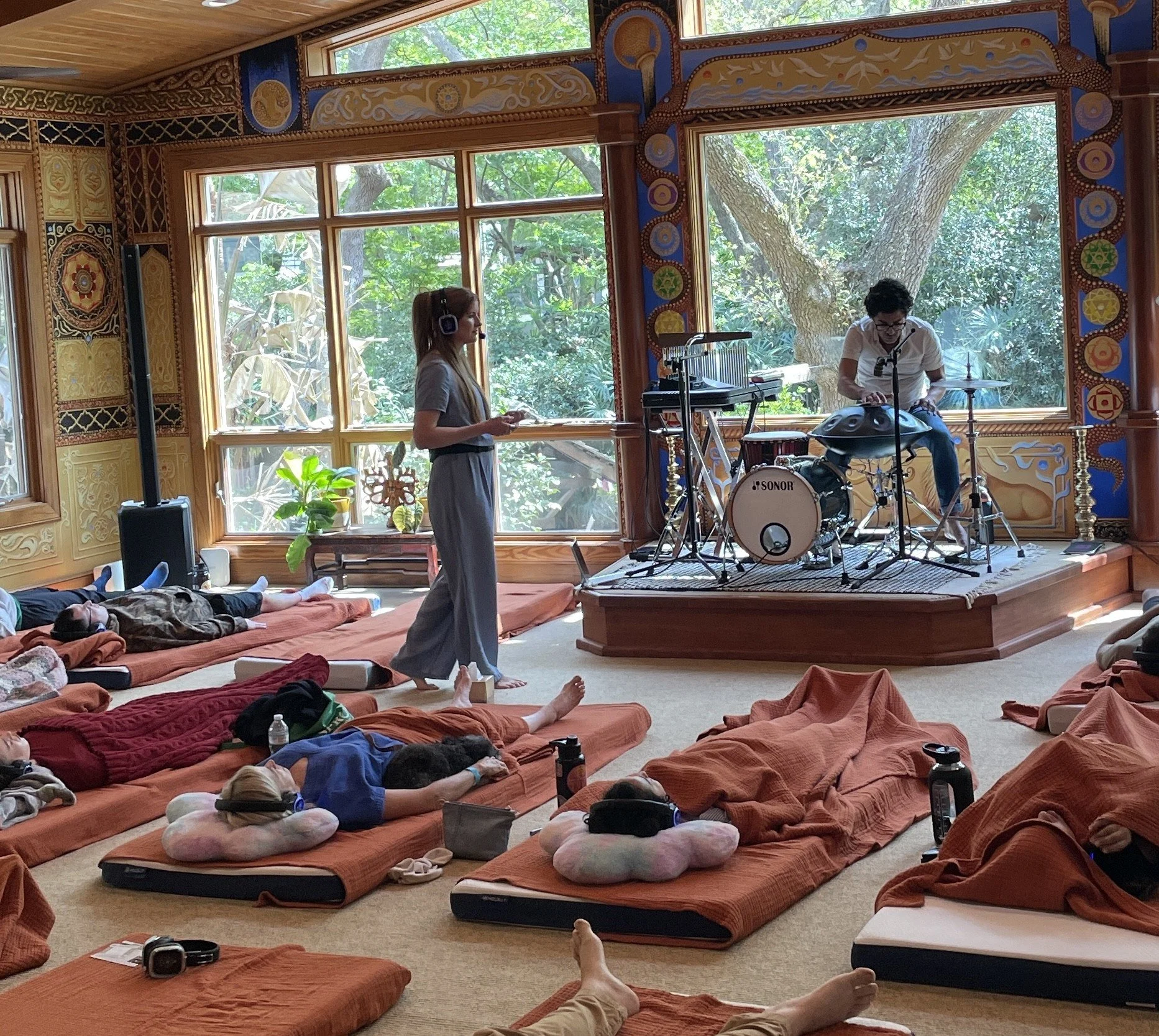 Breath & Beats immersive breathwork experience with silent-disco headphones and live music for a corporate team