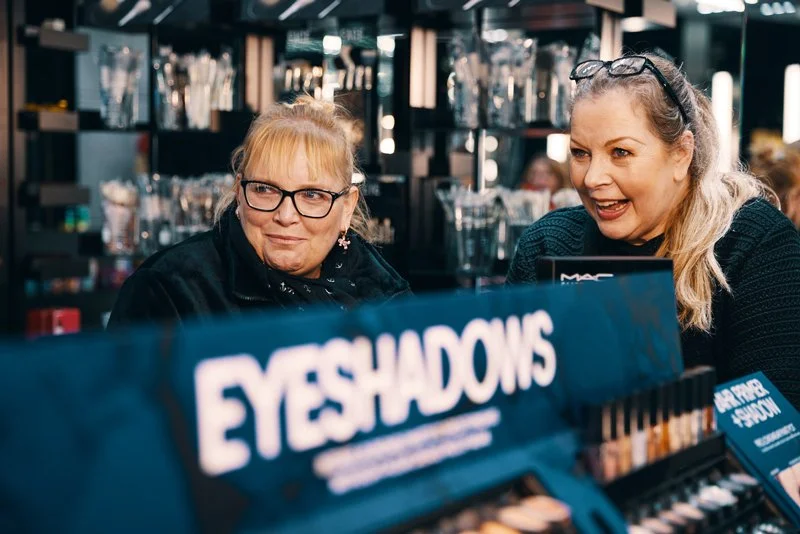 Two women smiling together at pamper event