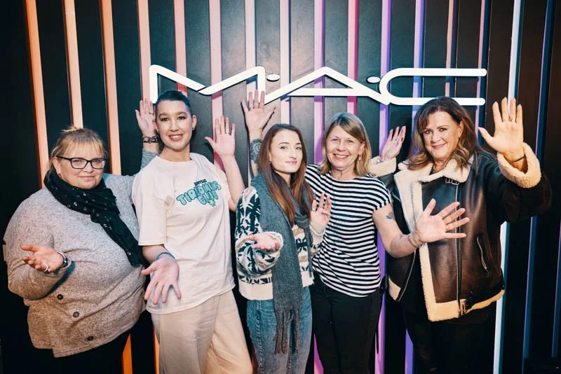 Makeup artist at MAC applying cosmetics during Forward Facing pamper day