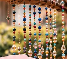 Hanging beaded suncatchers catching the light