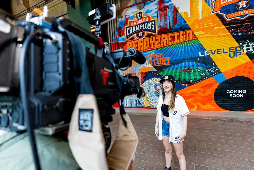Camera crew filming at the championship mural