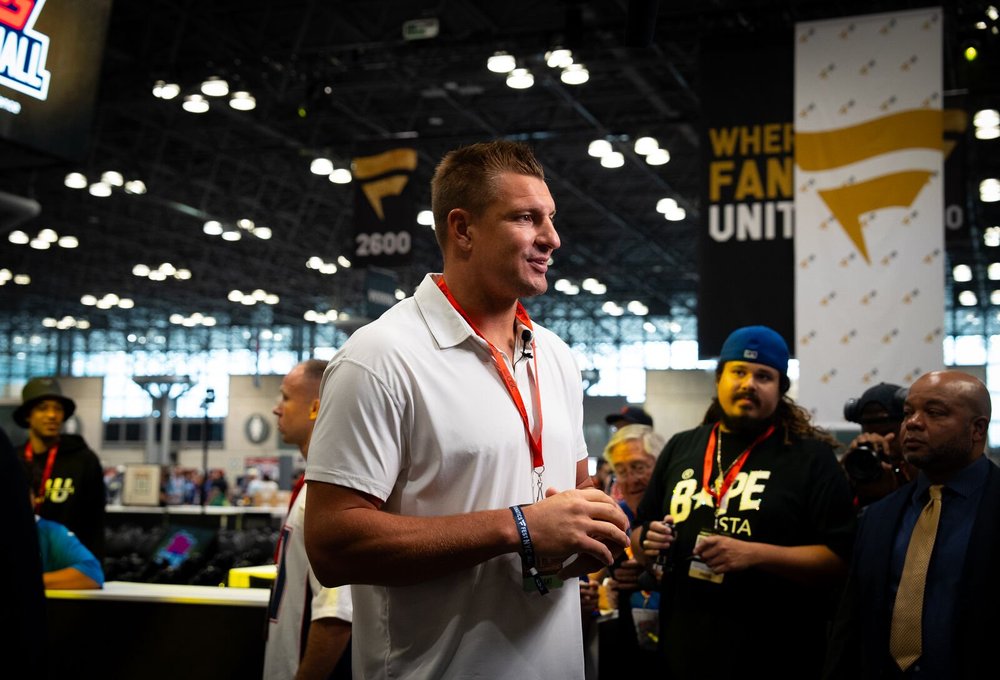 Guests talking on the card show floor
