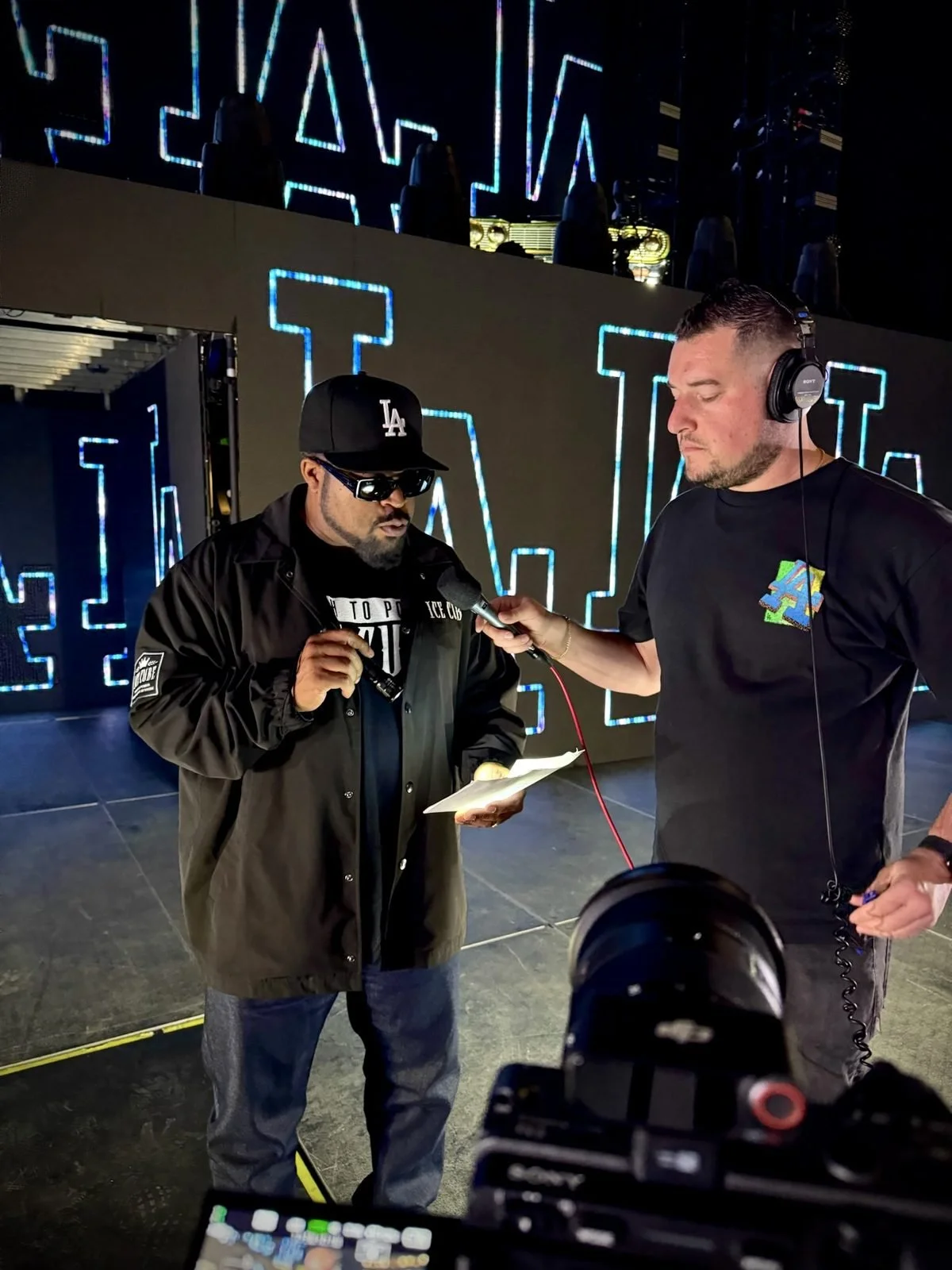 Matthew interviewing Ice Cube on set at Dodger Stadium
