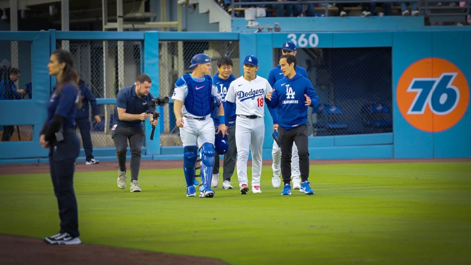 Matthew filming Dodgers players walking in from the outfield