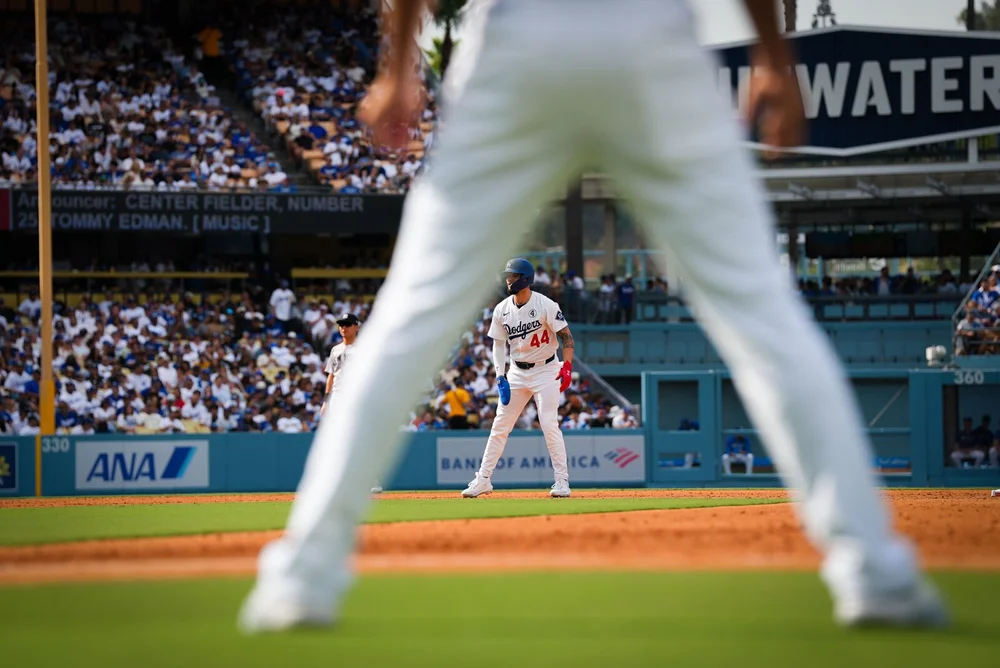 View from behind an outfielder toward the mound