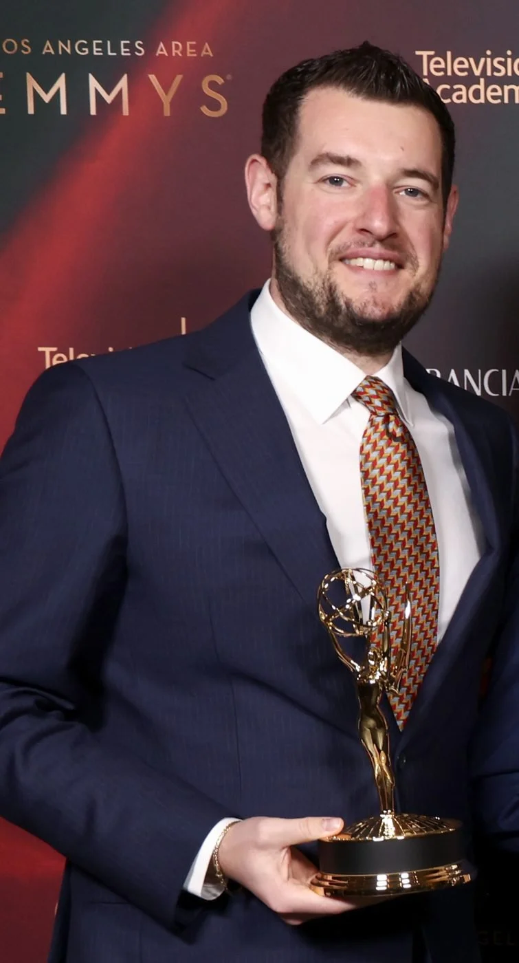 Matthew Blum holding an Emmy award at the Los Angeles Area Emmys