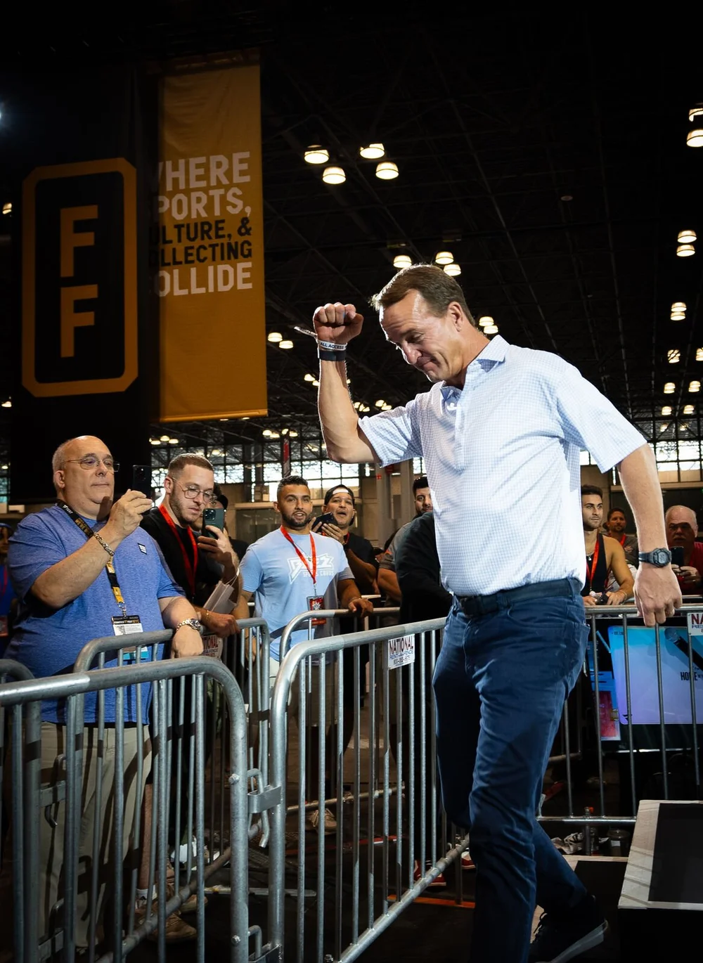 Peyton Manning celebrating at a card show