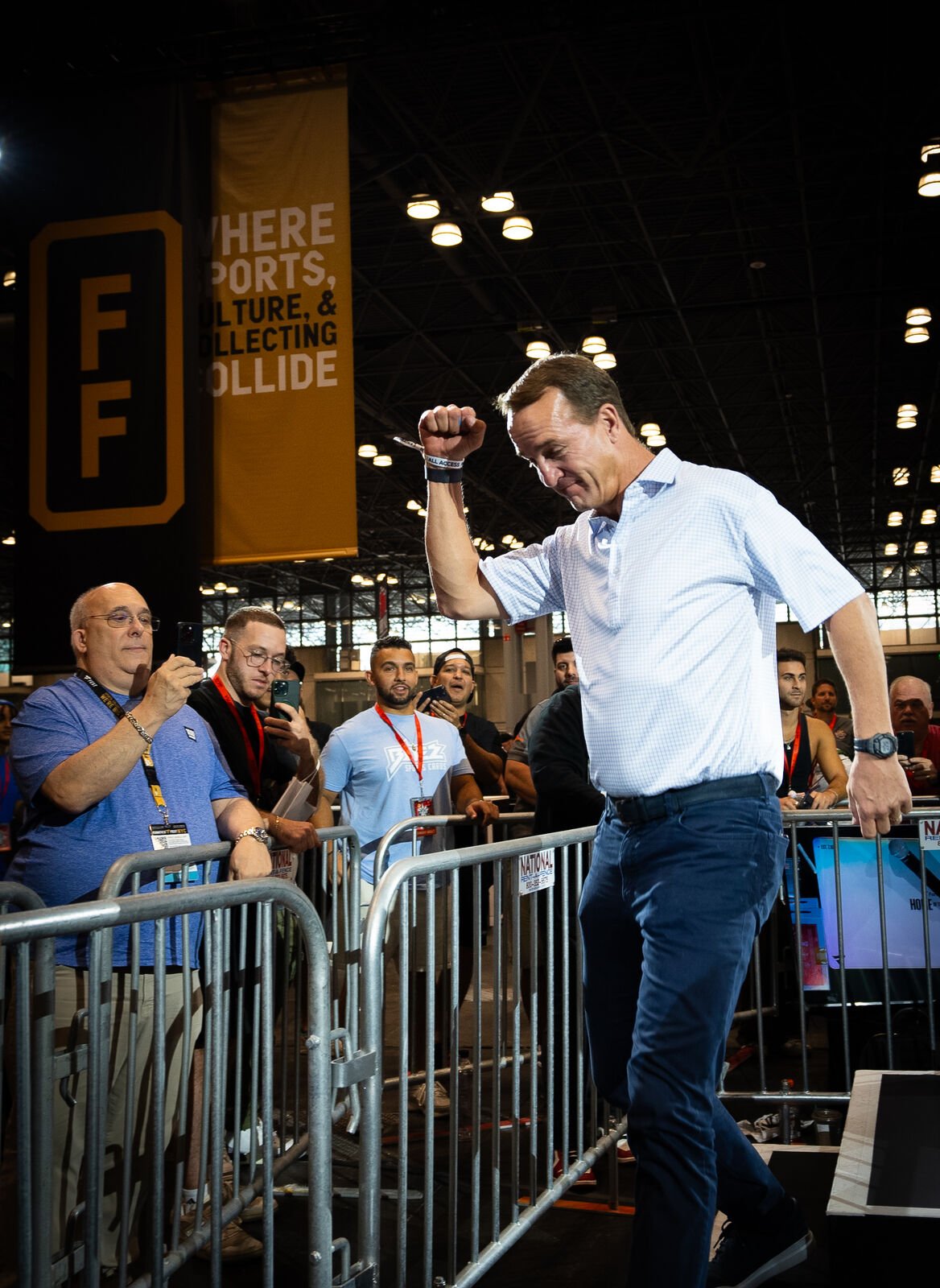 Peyton Manning celebrating at a card show