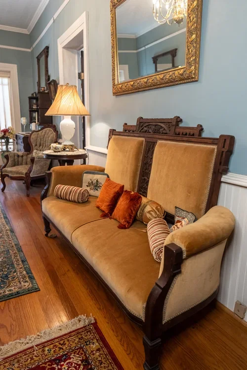 Silver tea set on red runner